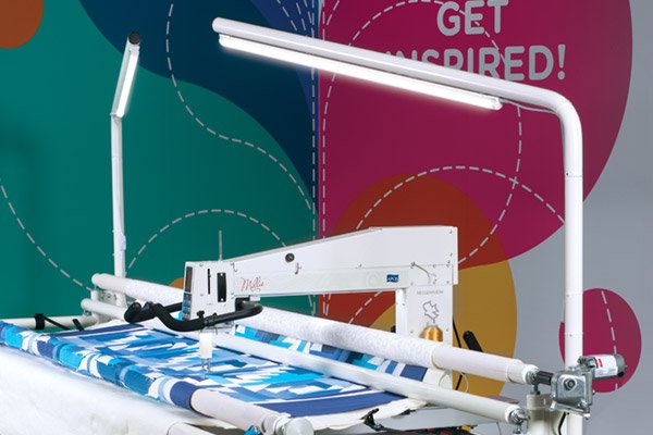 Overhead Lighting on deluxe table with APQS Millie longarm quilting machine