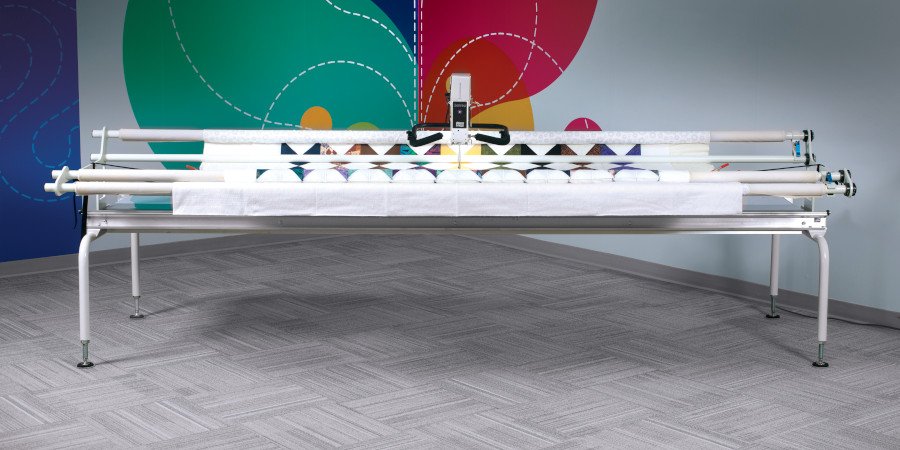 APQS quilting machine on table