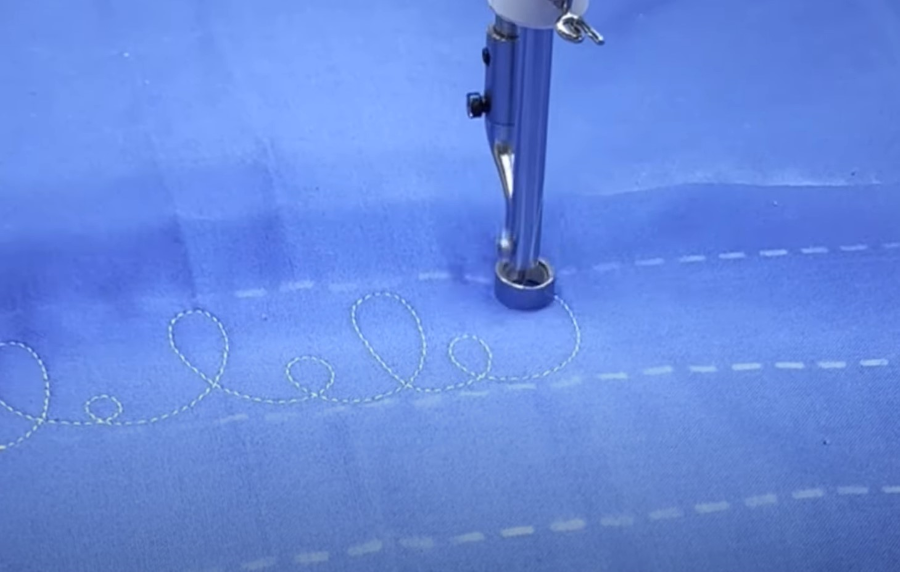 Free motion longarm loops on fabric
